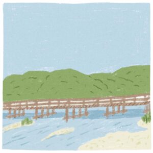 アートと建築とに彩られる嵐山。渡月橋に行くなら、立ち寄りたい2軒。 | 渡月橋　大堰川に架かる嵐山を象徴する渡月橋。起源は平安時代に遡り、空海の弟子・道昌が架けた法輪寺橋にあるという。渡月橋と呼ばれるようになったのは鎌倉時代。亀山上皇が満月の夜に舟遊びを楽しみ、月が橋の上を渡るように見えた景色を「くまなき月の渡るに似たり」と詠んだことに由来すると伝わっている。幾度となく川の氾濫で流され、現在のものは昭和9（1934）年に架けられたもの。▷京都市右京区嵯峨中ノ島町